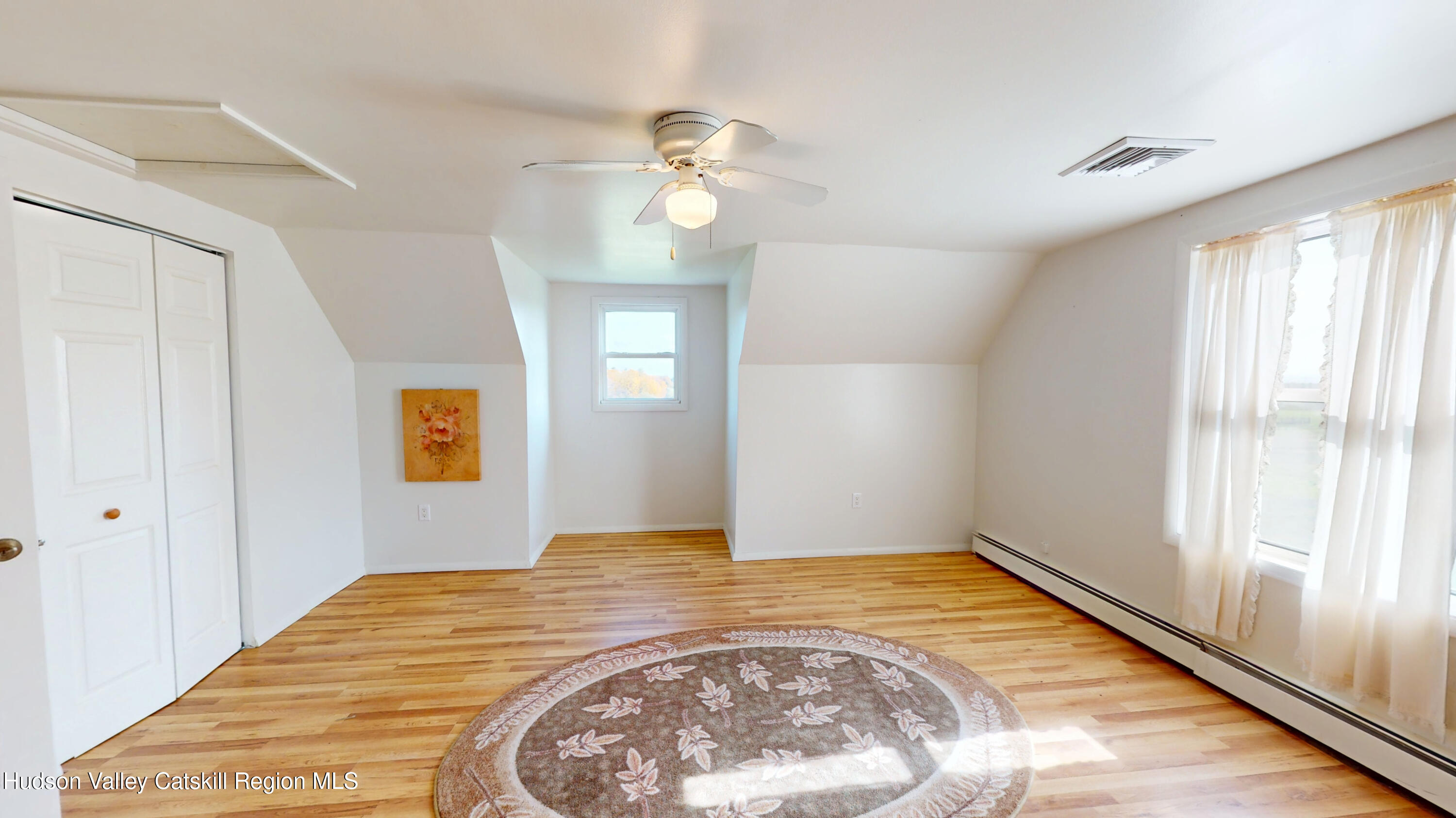 175 Jordan Road Coxsackie, NY 12051 - Photo 19 of 32 a view of empty room with window and wooden floor