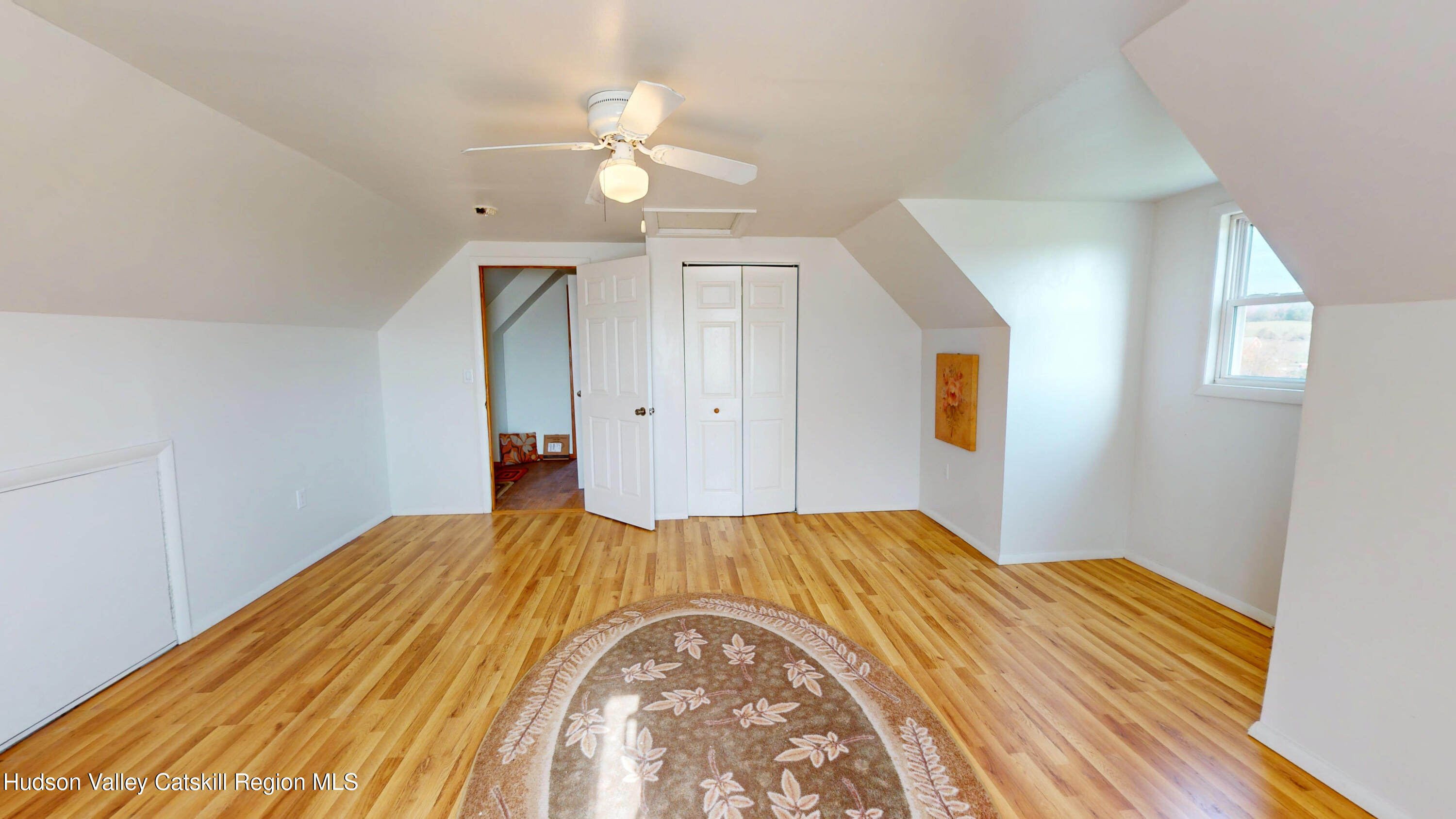 175 Jordan Road Coxsackie, NY 12051 - Photo 20 of 32 a bedroom with a bed and a chandelier