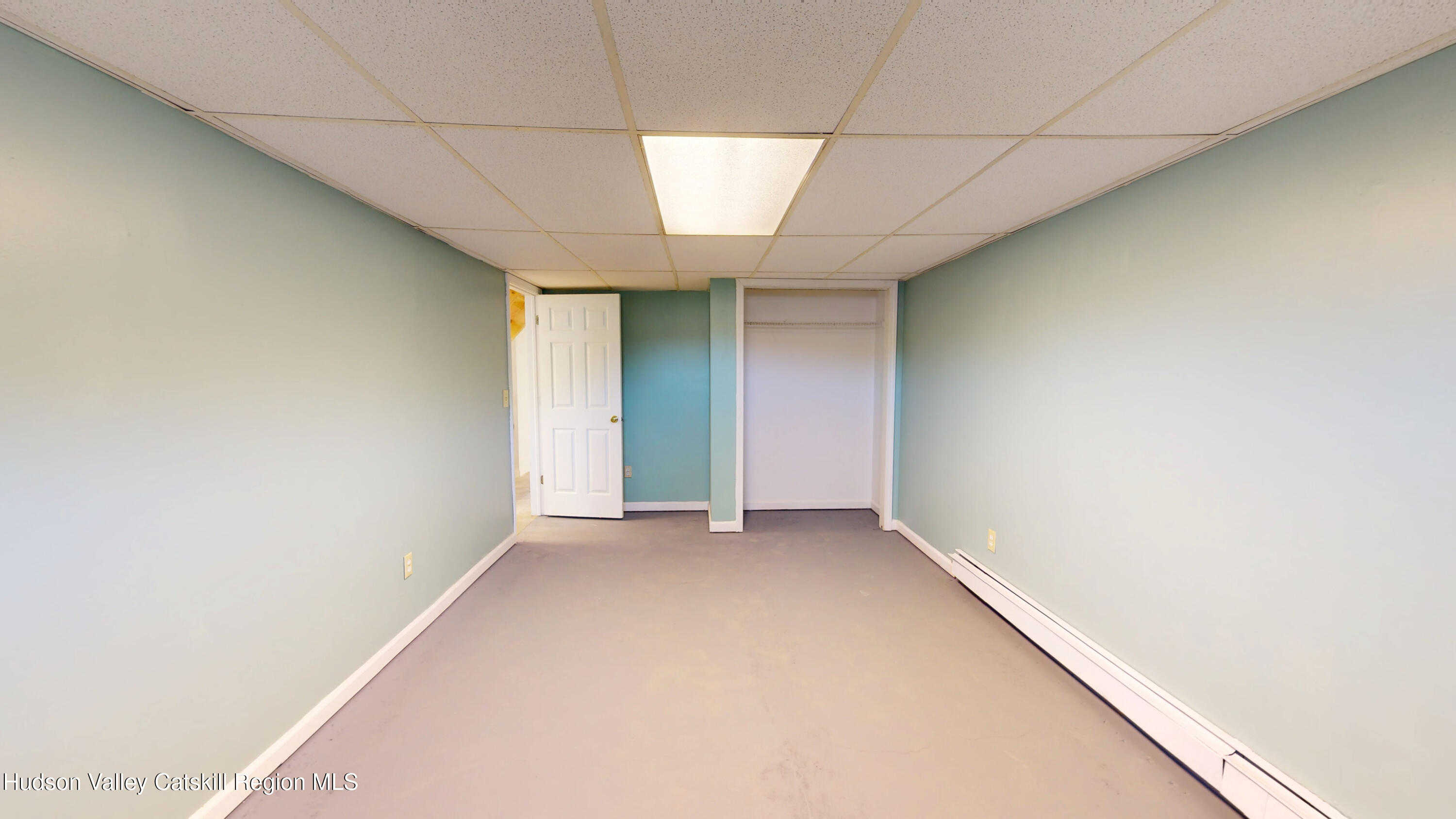 175 Jordan Road Coxsackie, NY 12051 - Photo 27 of 32 an empty room with a empty space and windows