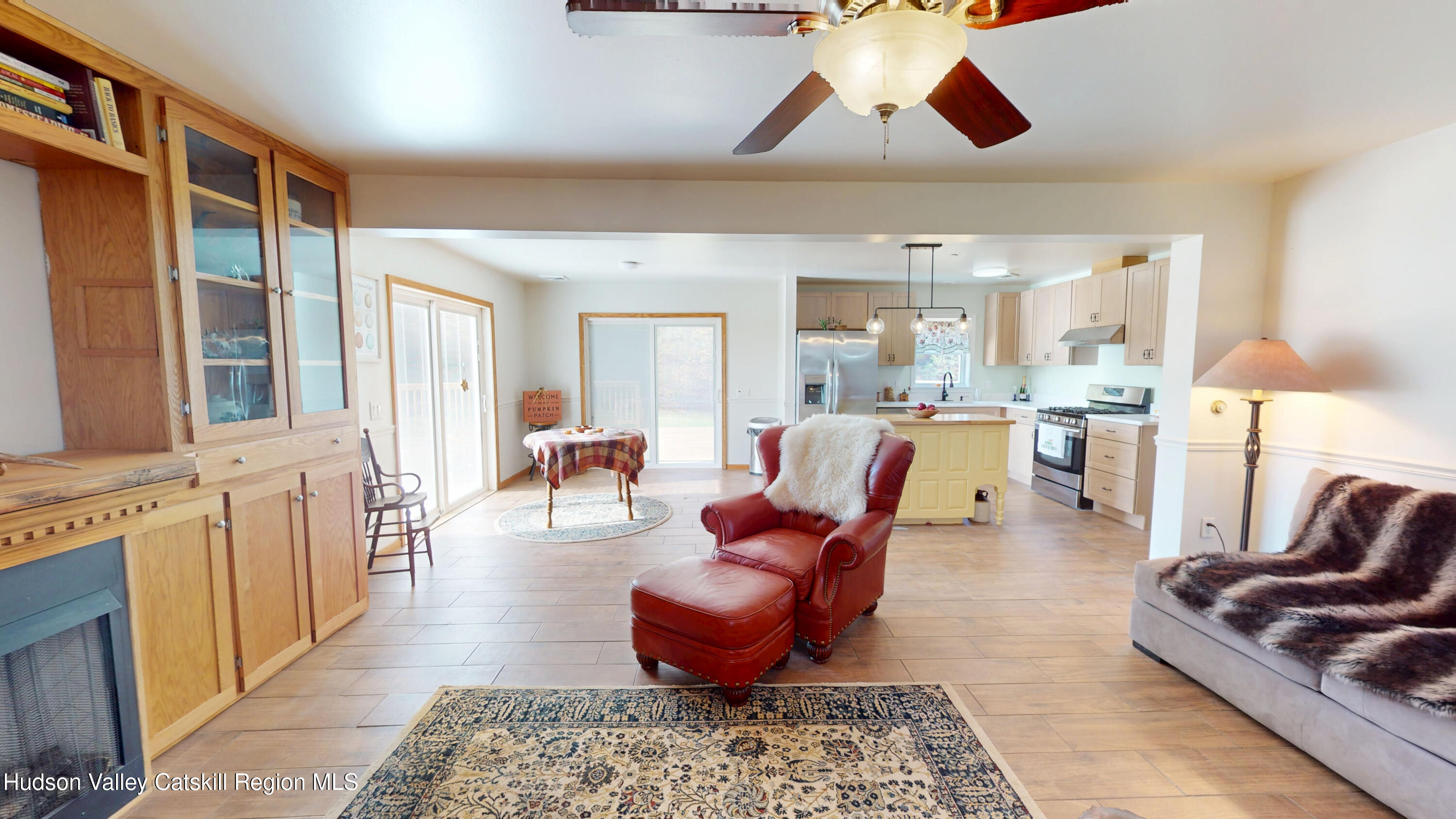 175 Jordan Road Coxsackie, NY 12051 - Photo 4 of 32 a living room with furniture a rug and a chandelier