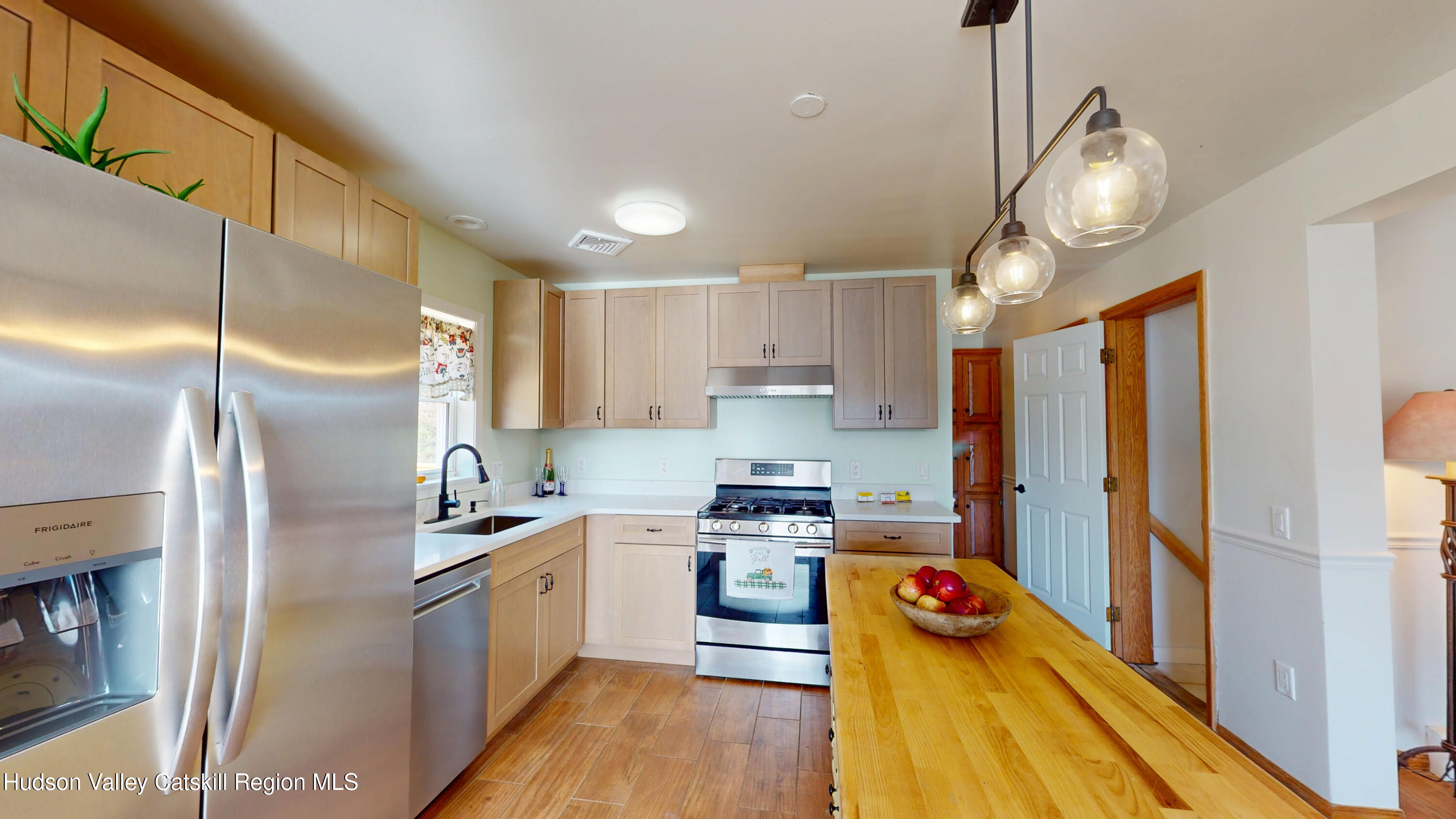 175 Jordan Road Coxsackie, NY 12051 - Photo 8 of 32 a kitchen with stainless steel appliances a stove a refrigerator and a view of living room