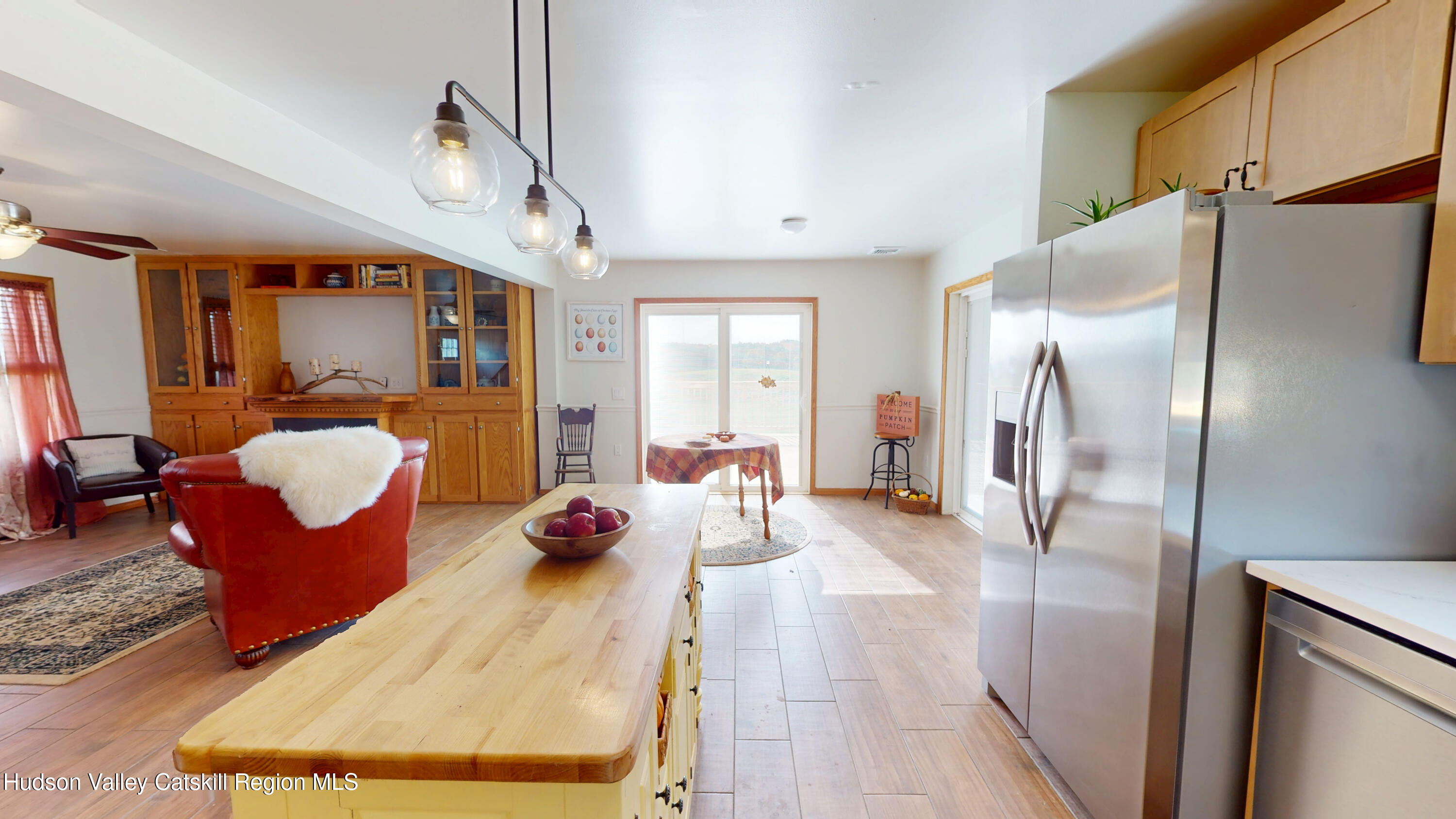 175 Jordan Road Coxsackie, NY 12051 - Photo 9 of 32 a living room with furniture mirror and a chandelier