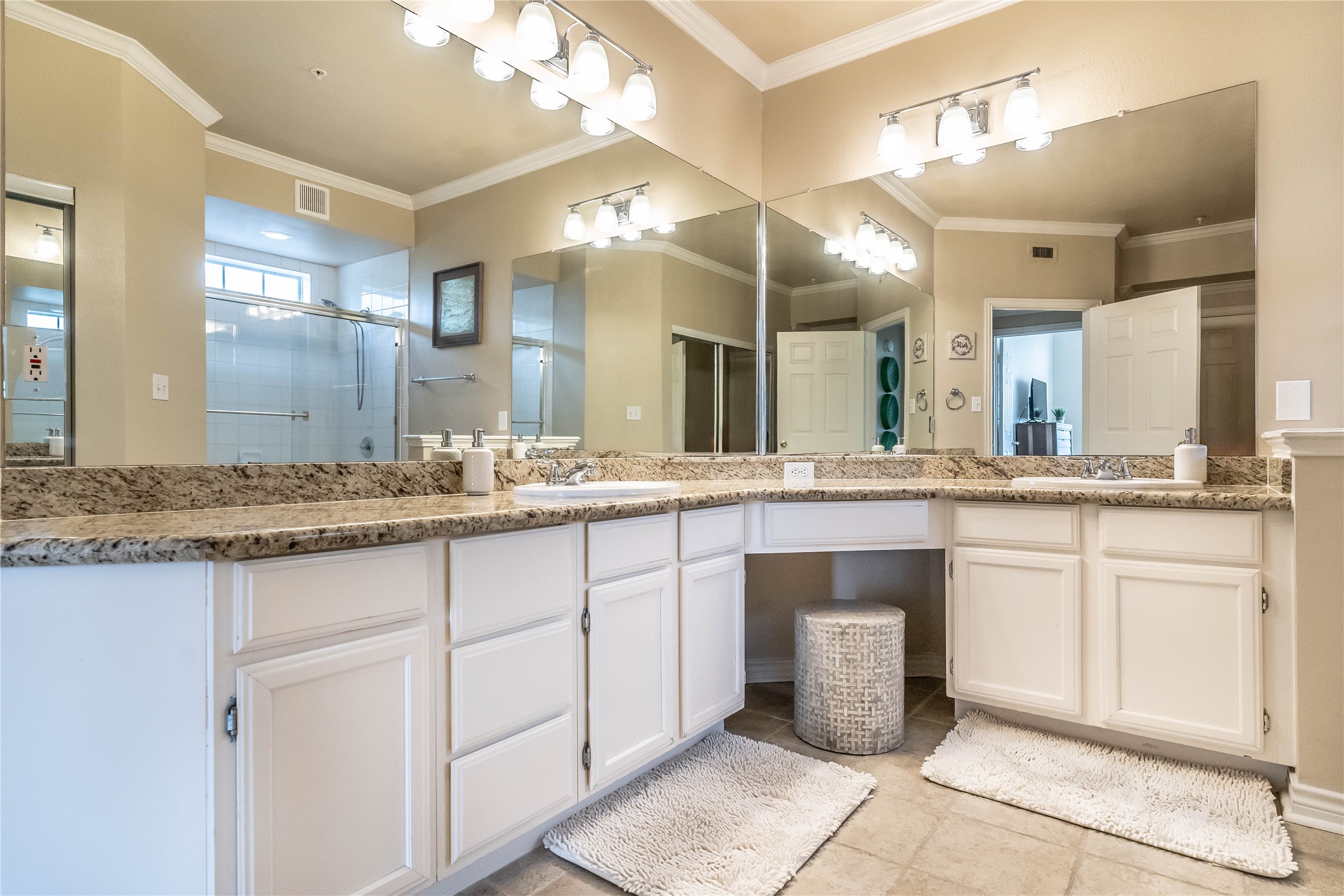2111 Welch Street, Unit A232 Houston, TX 77019 - Photo 13 of 20 a bathroom with a sink and a mirror