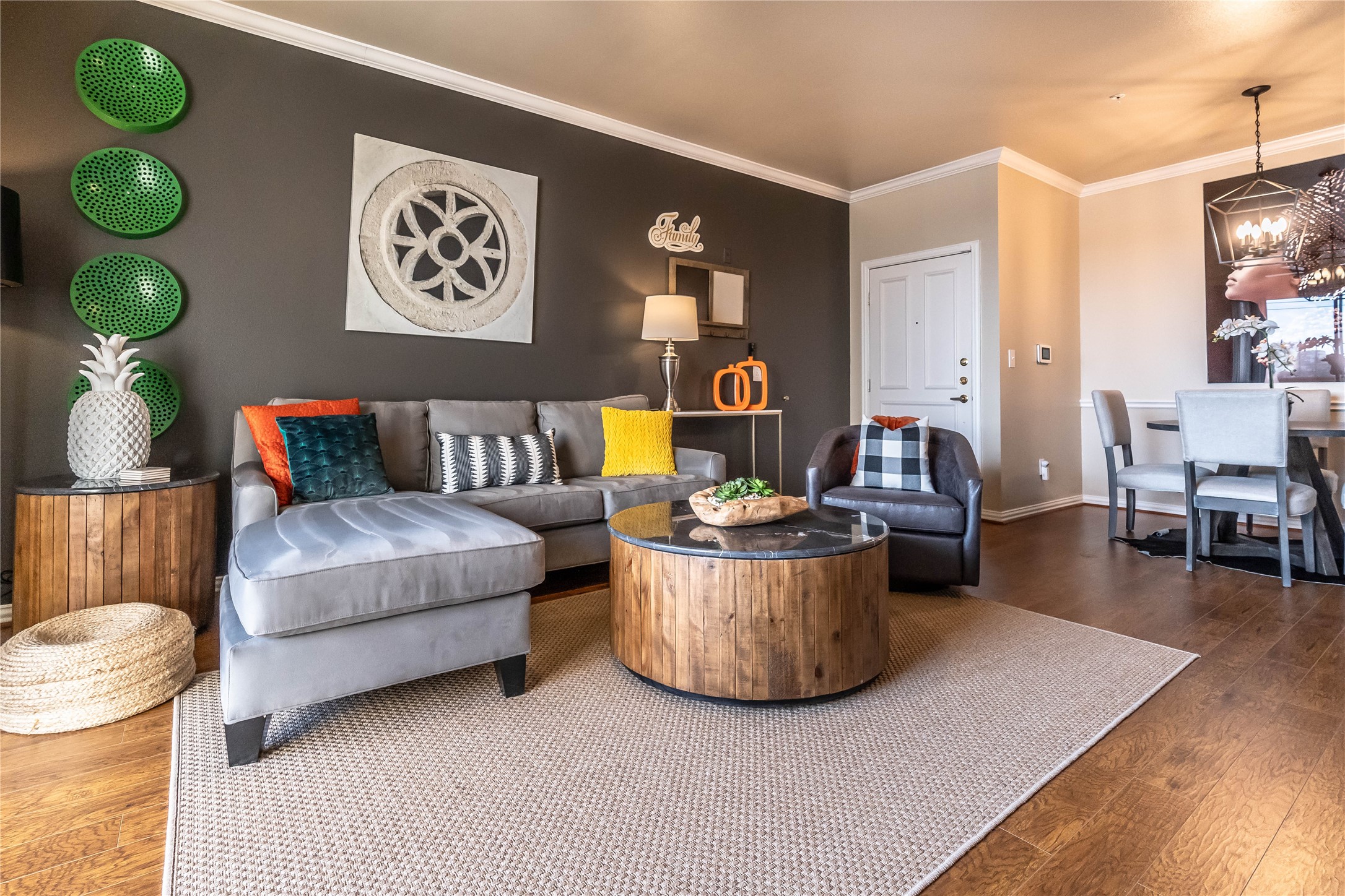2111 Welch Street, Unit A232 Houston, TX 77019 - Photo 2 of 20 a living room with furniture and a wooden floor