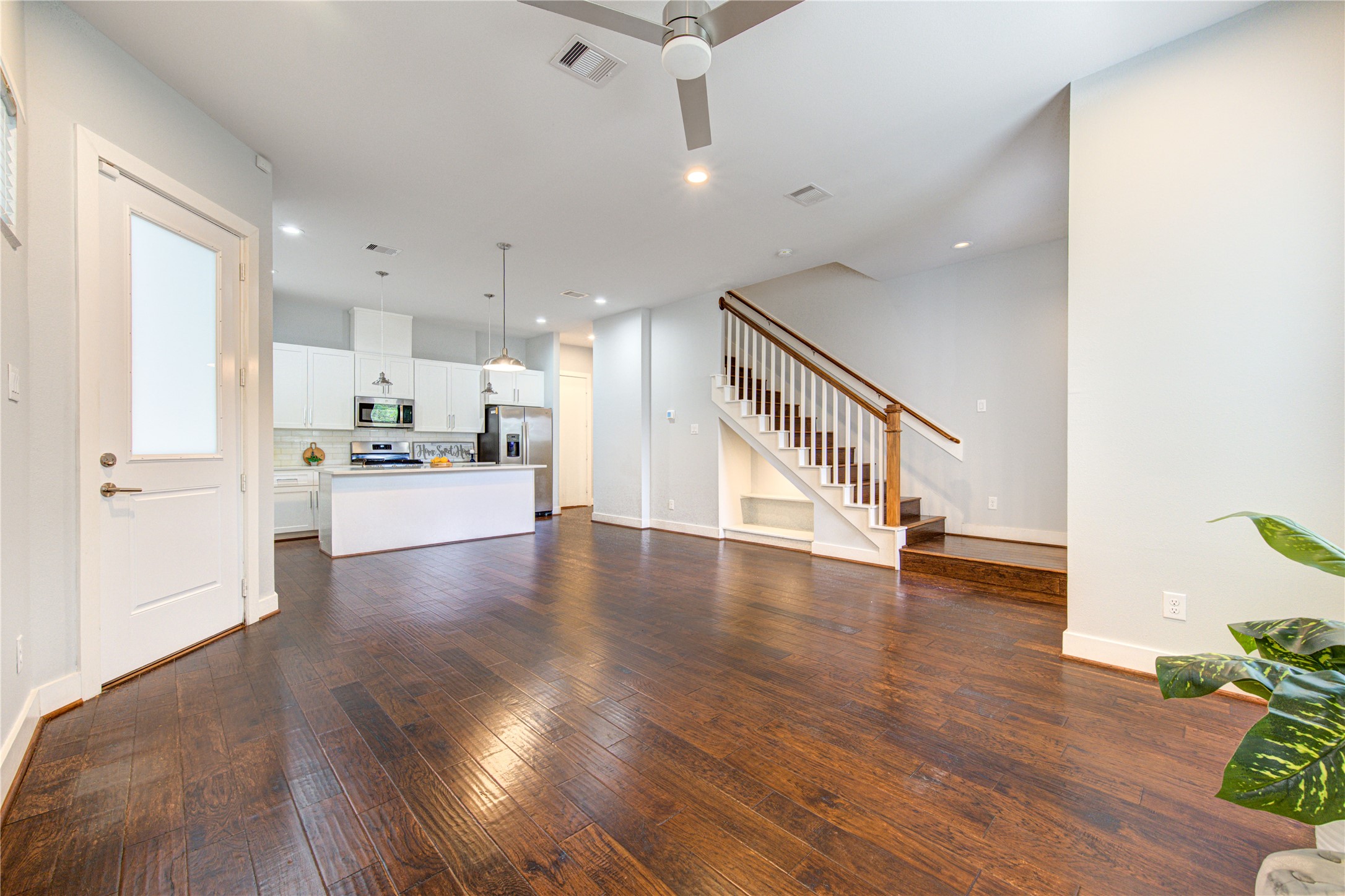 847 Rachel Street, Unit G Houston, TX 77091 - Photo 13 of 42 Functional under-stair storage complemented by an elegant wood staircase.