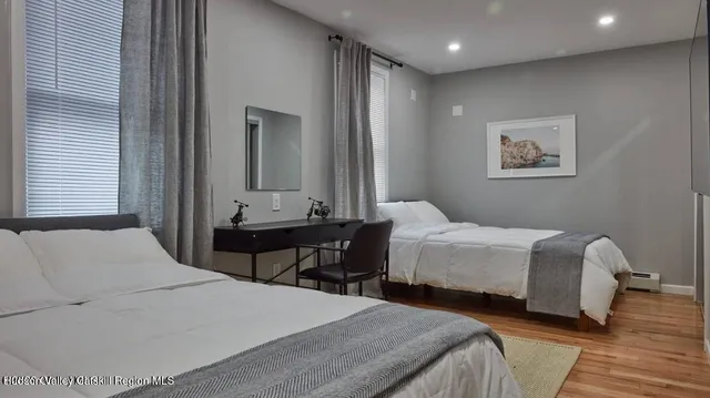 a bedroom with a bed and a table