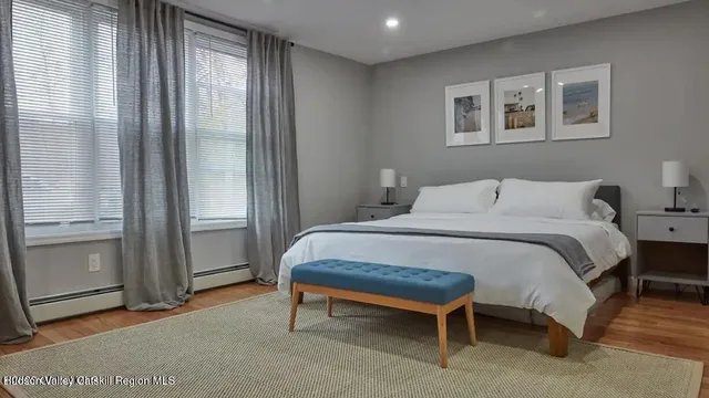 a bedroom with a bed and a table