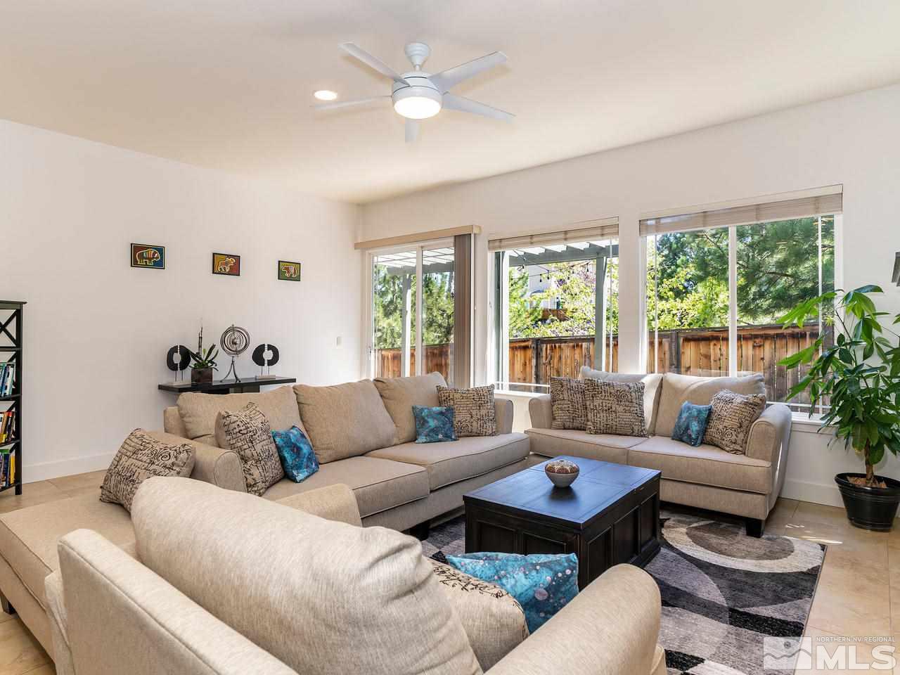 5021 Fall Colors Court Reno, NV 89519 - Photo 11 of 26 a living room with furniture and a large window