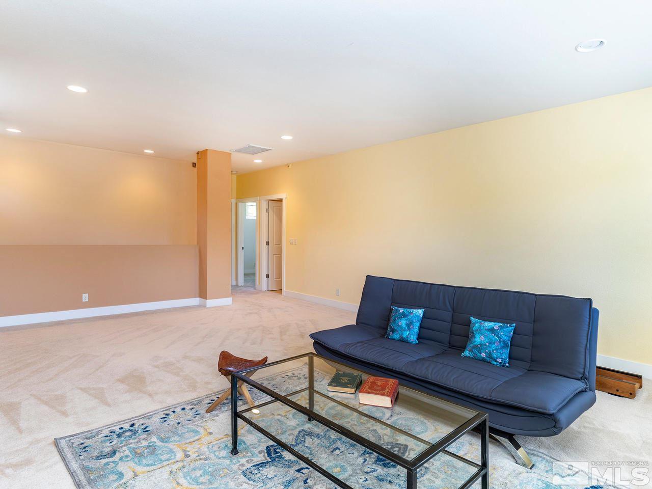 5021 Fall Colors Court Reno, NV 89519 - Photo 19 of 26 a living room with furniture and a rug