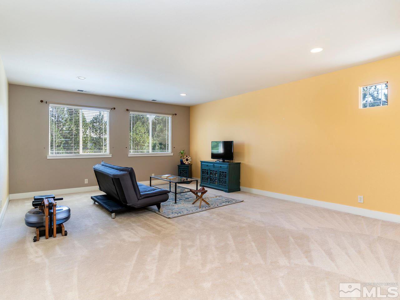 5021 Fall Colors Court Reno, NV 89519 - Photo 20 of 26 a living room with furniture and a window
