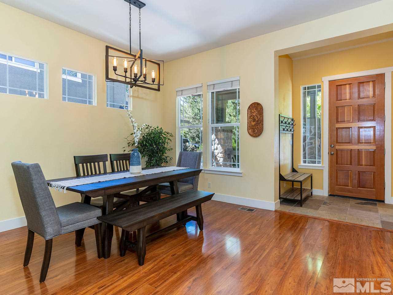 5021 Fall Colors Court Reno, NV 89519 - Photo 2 of 26 a view of a dining room with furniture window and wooden floor