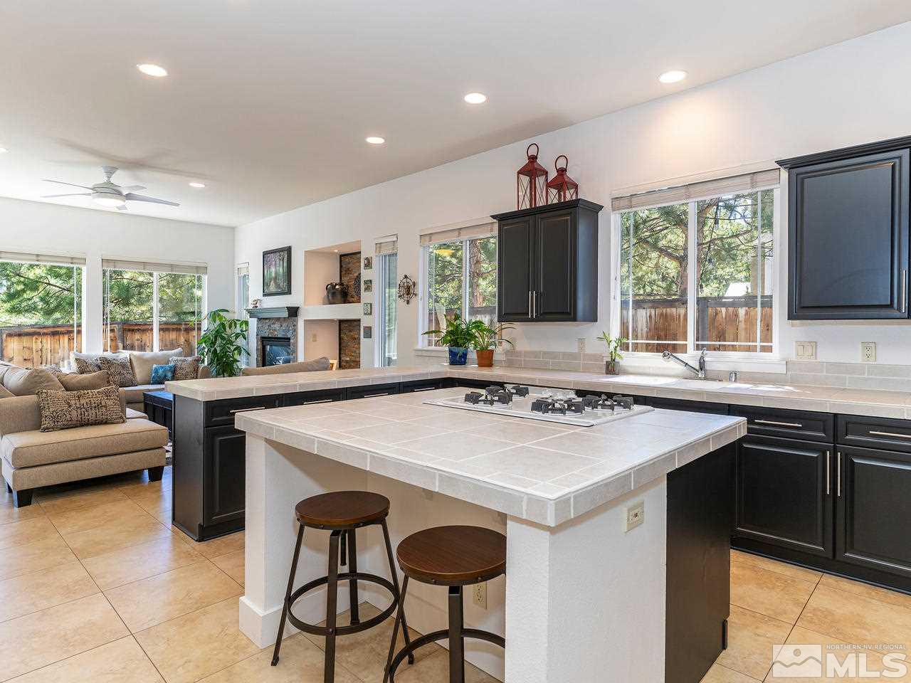 5021 Fall Colors Court Reno, NV 89519 - Photo 8 of 26 a kitchen with a stove a sink and a refrigerator