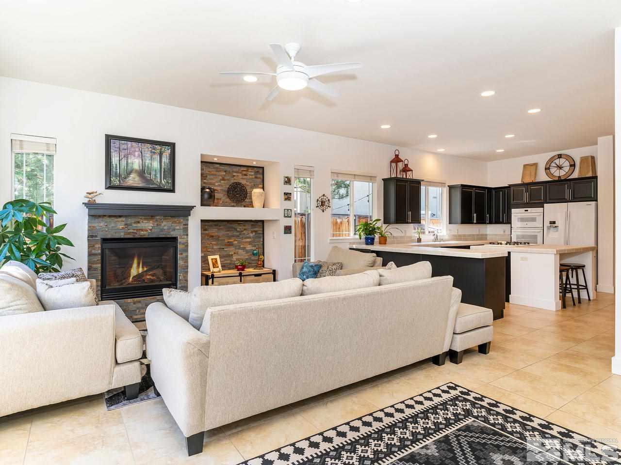 5021 Fall Colors Court Reno, NV 89519 - Photo 10 of 26 a living room with furniture and a fireplace