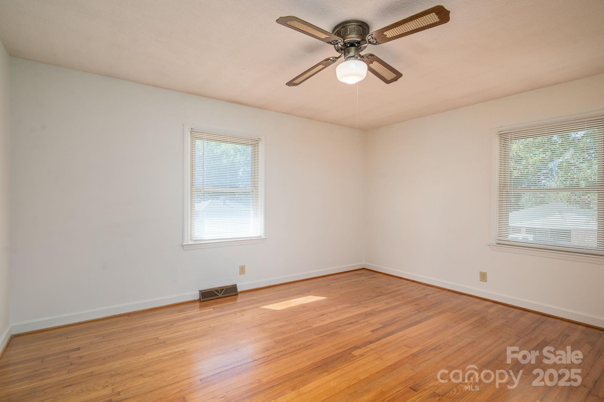 215 Suncrest Road Cherryville, NC 28021 - Photo 12 of 26 a view of a big room with wooden floor and windows