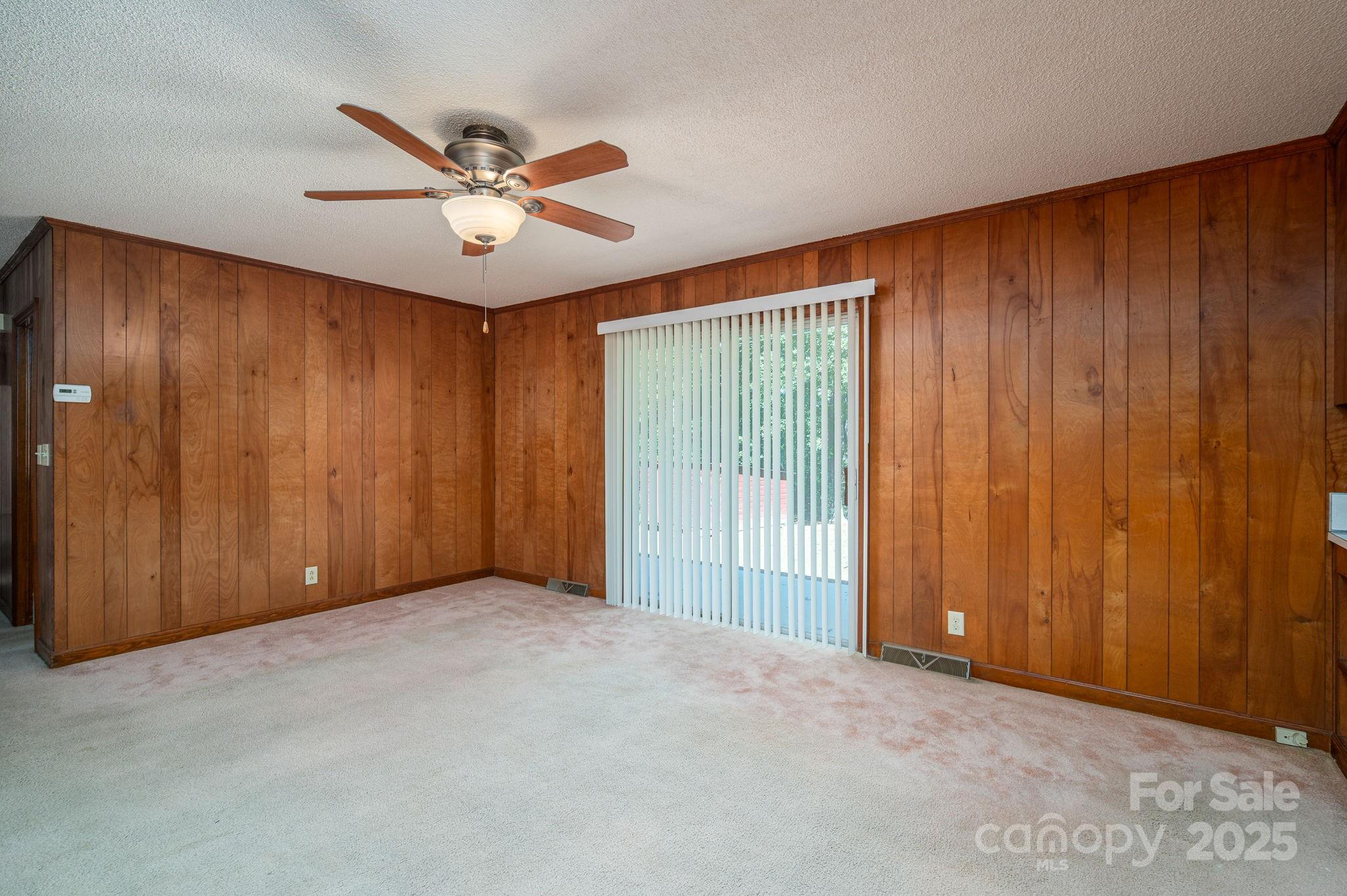 215 Suncrest Road Cherryville, NC 28021 - Photo 17 of 26 a view of an empty room with a ceiling fan