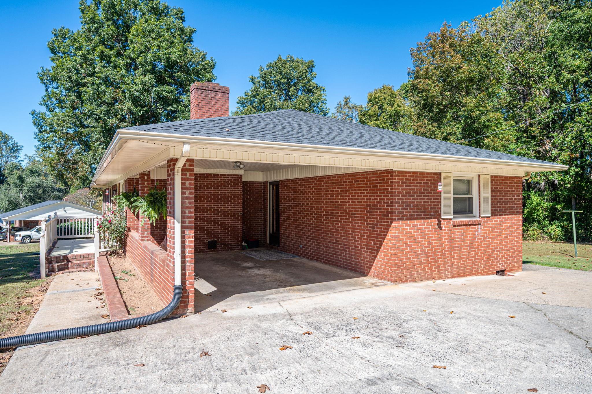 215 Suncrest Road Cherryville, NC 28021 - Photo 20 of 26 a view of a house with a backyard