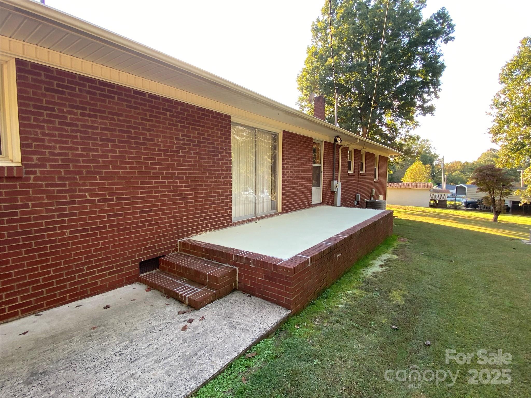 215 Suncrest Road Cherryville, NC 28021 - Photo 24 of 26 a view of a backyard with a garden