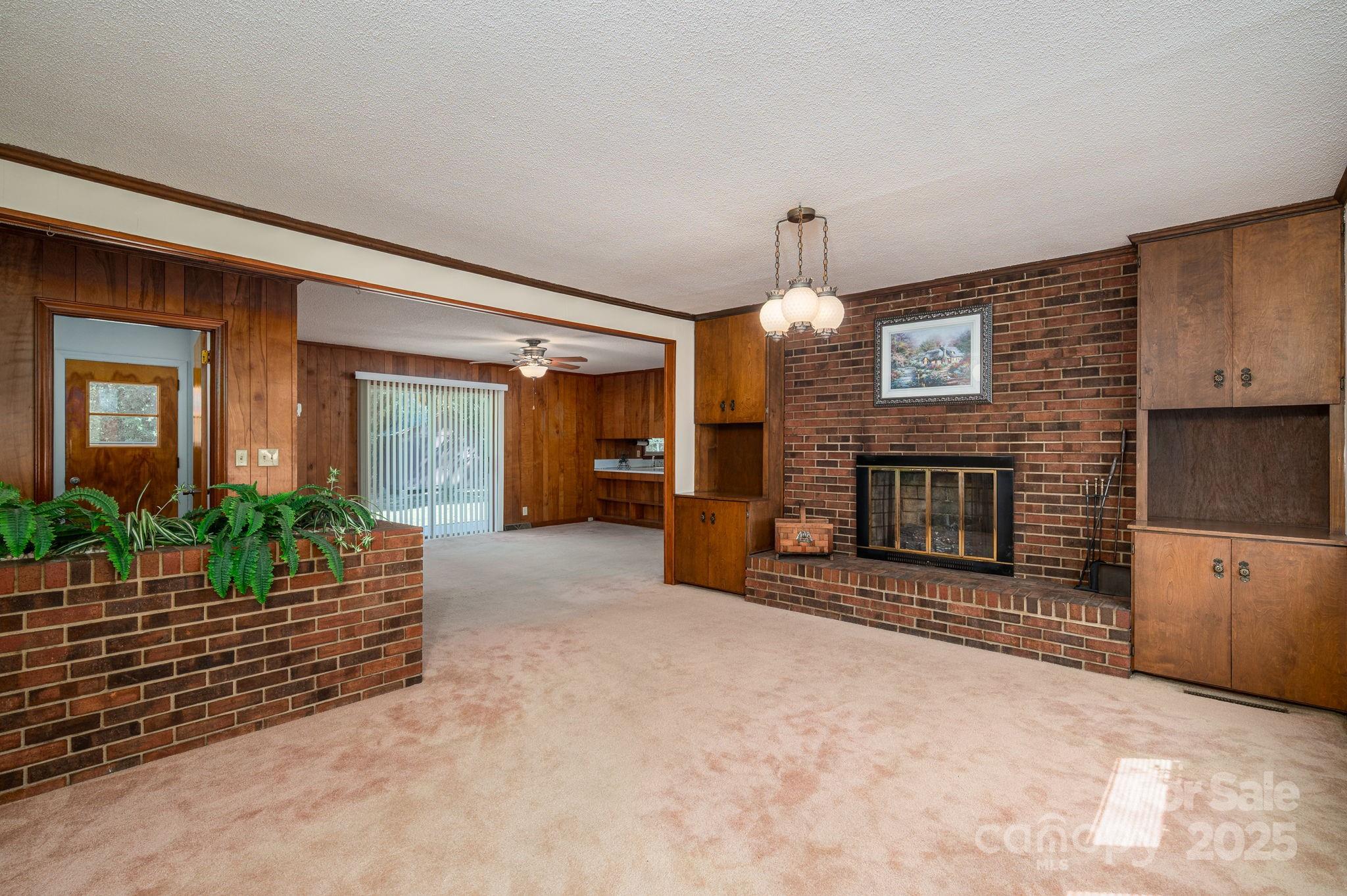 215 Suncrest Road Cherryville, NC 28021 - Photo 7 of 26 a living room with furniture and a fireplace