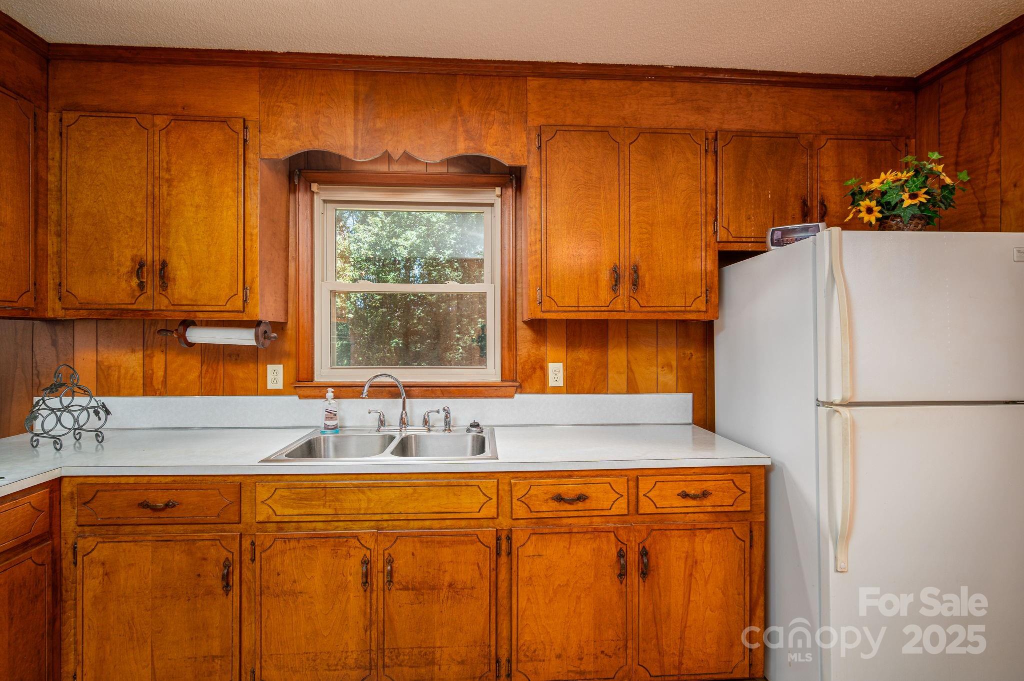215 Suncrest Road Cherryville, NC 28021 - Photo 8 of 26 a white refrigerator freezer sitting in a kitchen