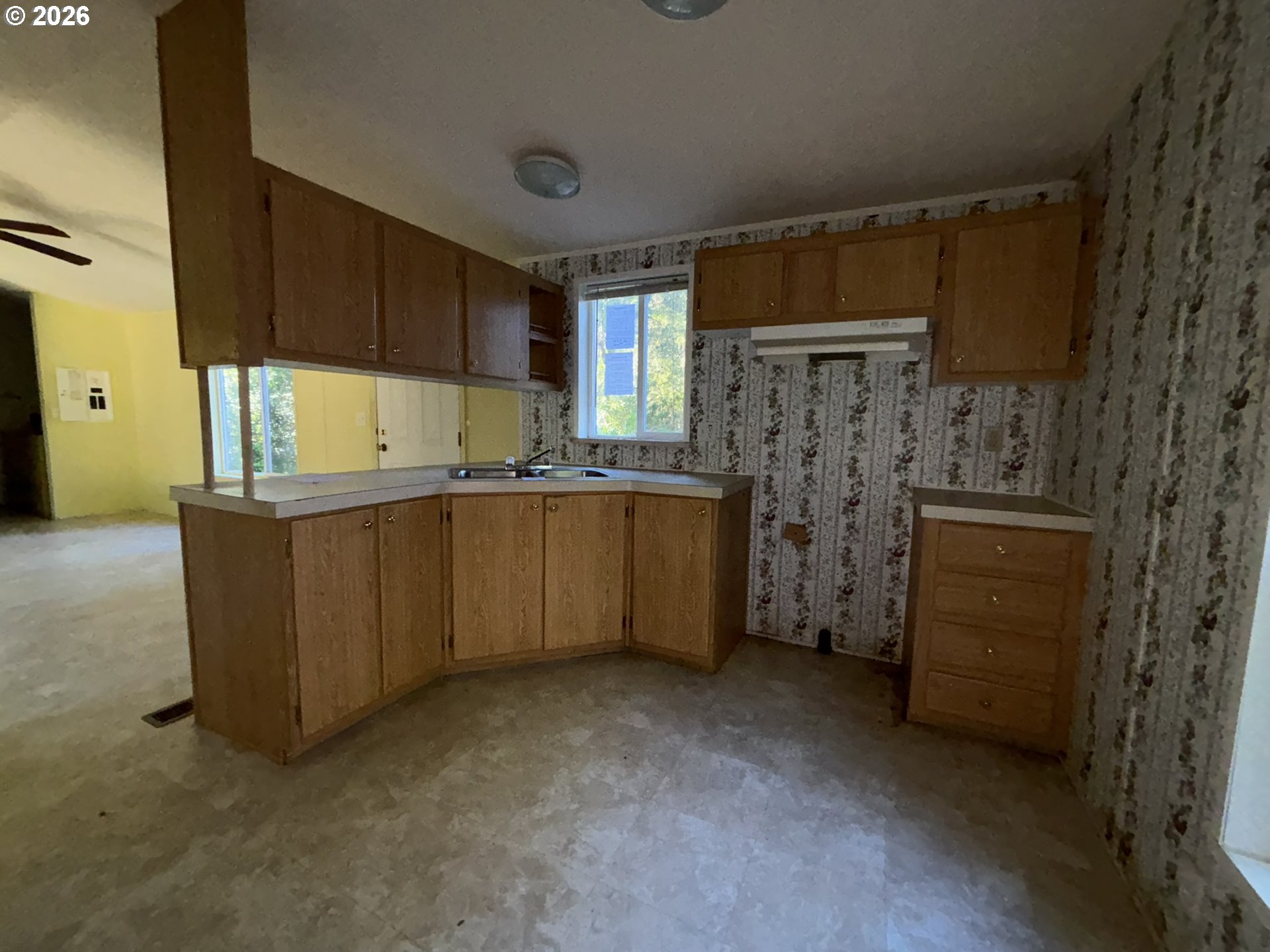 64 Outer Drive Florence, OR 97439 - Photo 8 of 8 a kitchen with a sink and cabinets