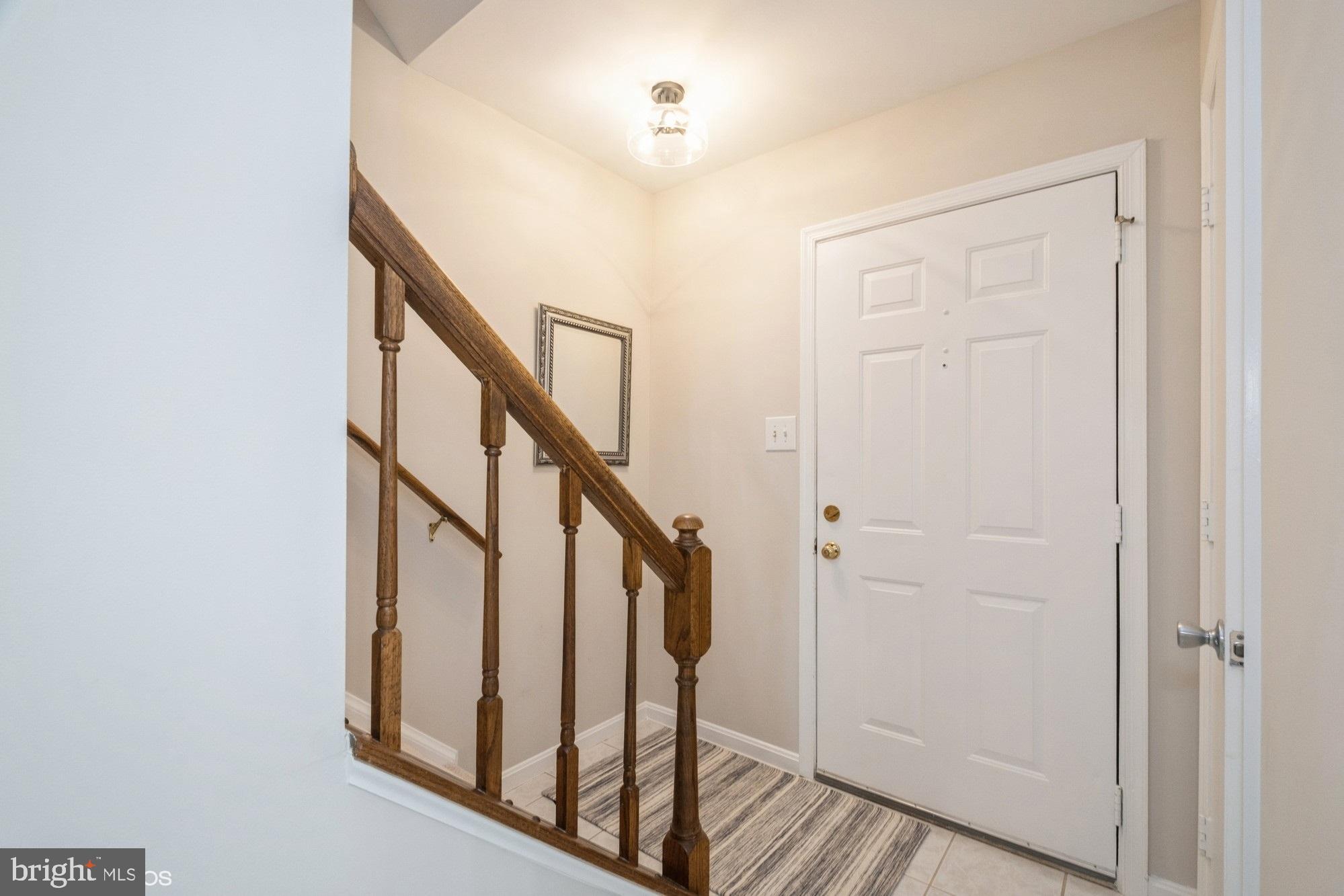 77 Sudbury Square Sterling, VA 20164 - Photo 17 of 33 Front Door and Stairway to Bedrooms