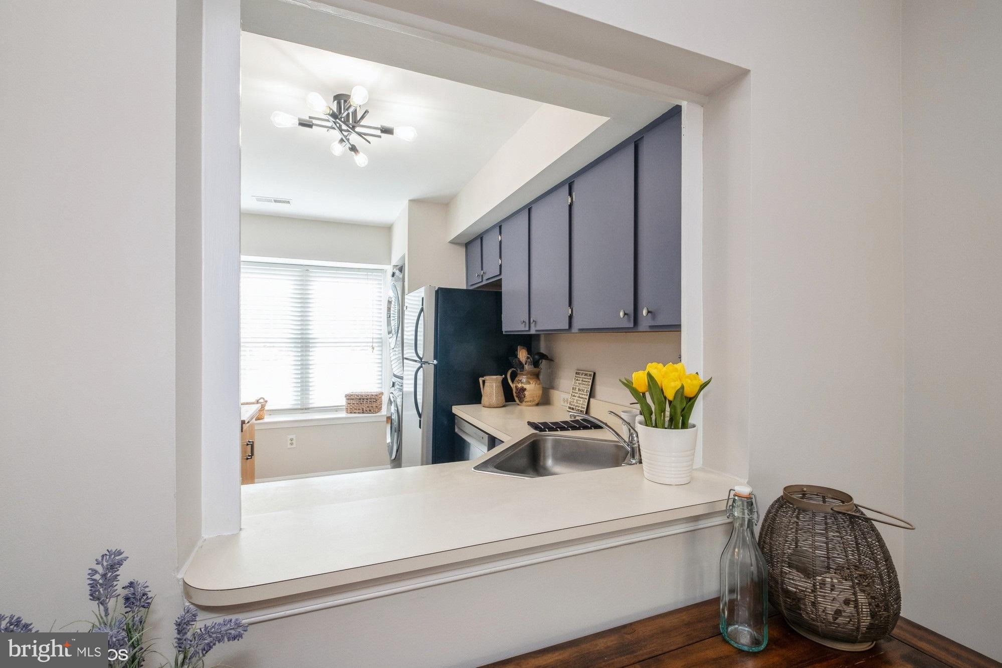 77 Sudbury Square Sterling, VA 20164 - Photo 10 of 33 Convenient Passthrough into Kitchen