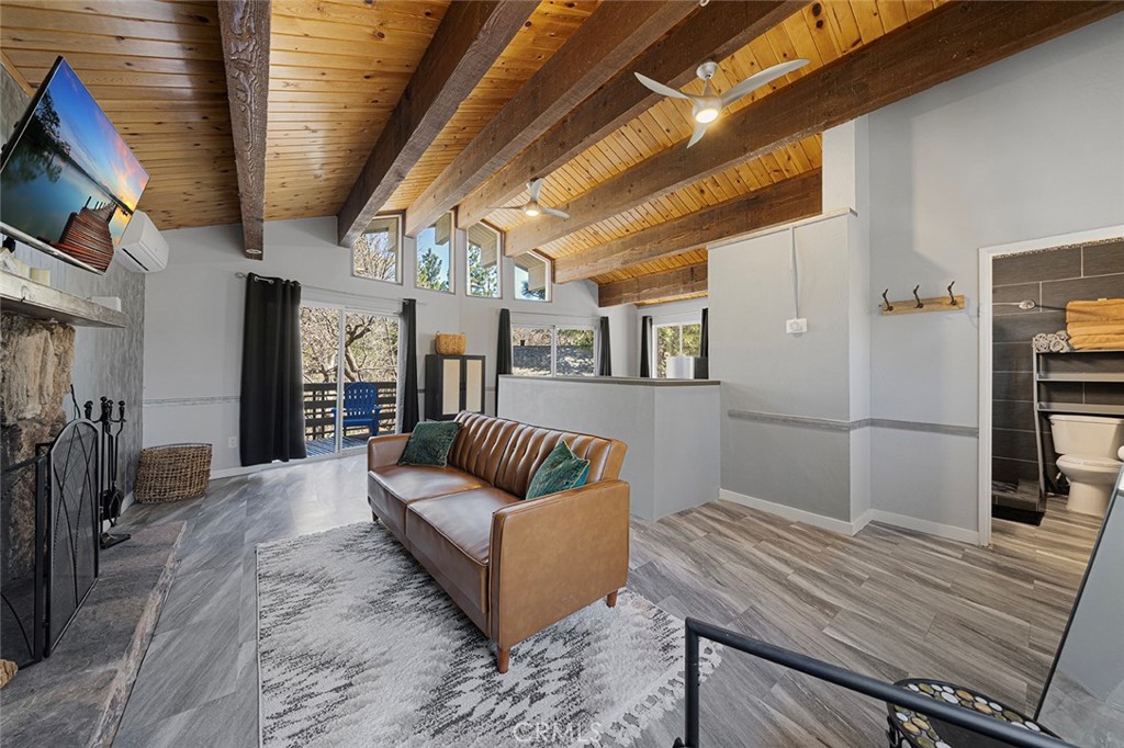 33080 Robin Lane Running Springs, CA 92382 - Photo 17 of 35 a living room with furniture and a wooden floor