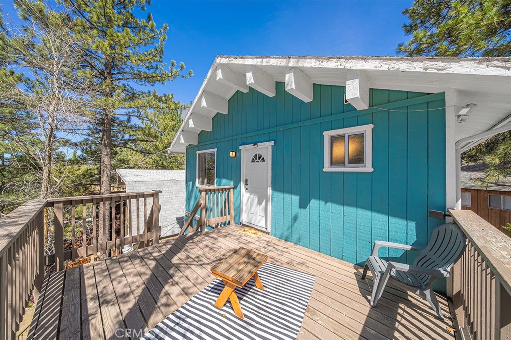 33080 Robin Lane Running Springs, CA 92382 - Photo 8 of 35 a view of a house with backyard and deck