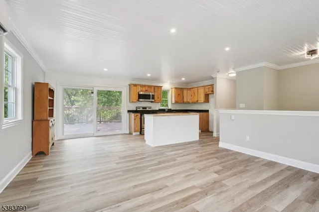 a view of kitchen and wooden floor