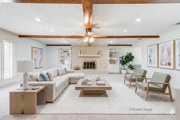 a view of a hallway with a chandelier fan
