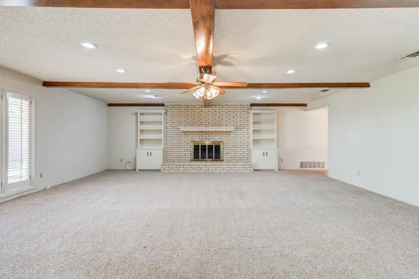 a kitchen with stainless steel appliances white cabinets and a stove
