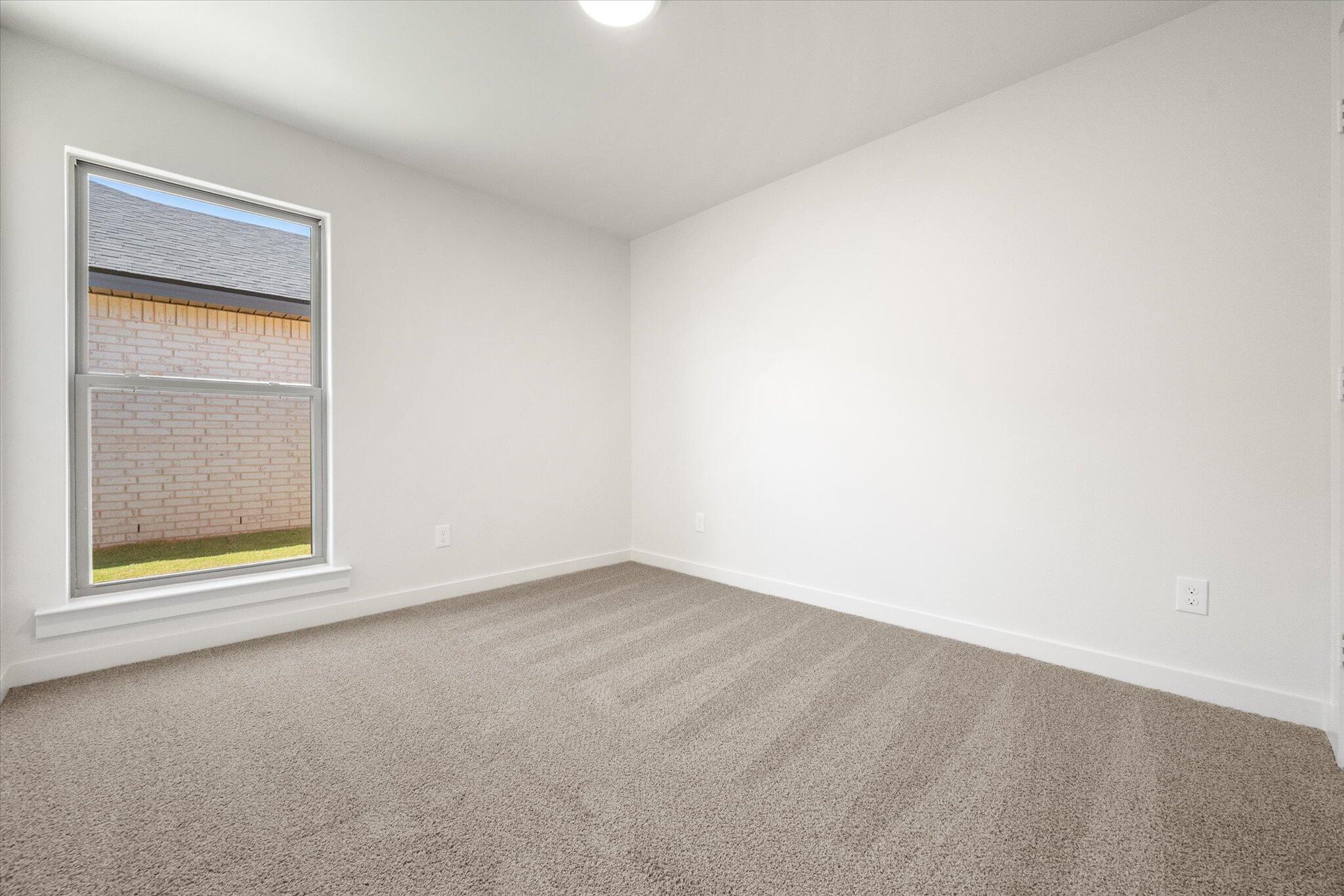 7214 8th Street Lubbock, TX 79416 - Photo 17 of 23 an empty room with a window