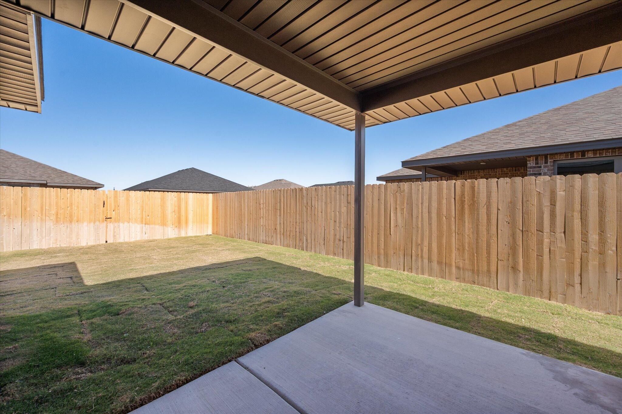 7214 8th Street Lubbock, TX 79416 - Photo 21 of 23 a backyard of a house