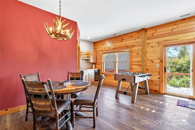 a view of a dining room with furniture and window