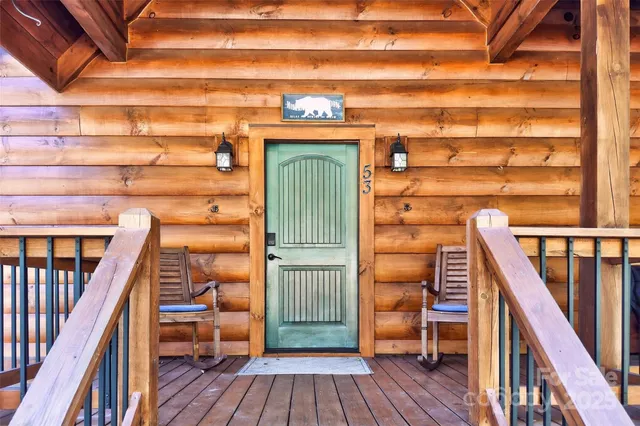 a view of a balcony with wooden floor and staircase