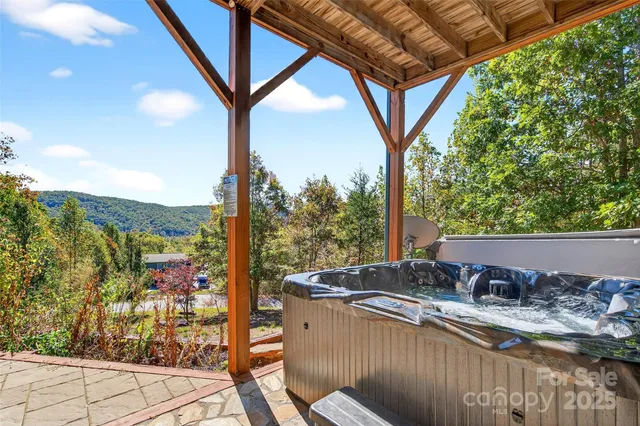 a view of a livingroom with workspace and a window