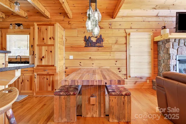a living room with furniture a large window with outer view