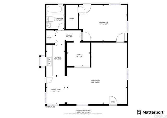 a view of a house with a small yard and covered with snow