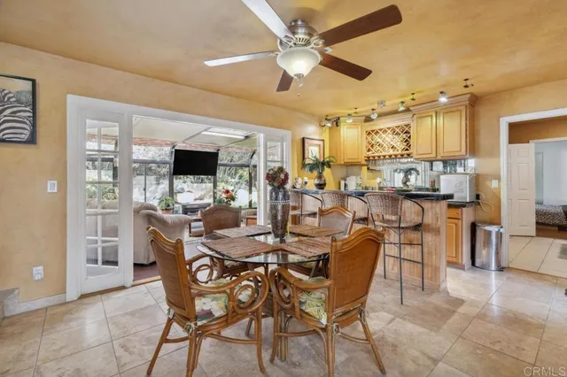 a kitchen with granite countertop a sink and cabinets