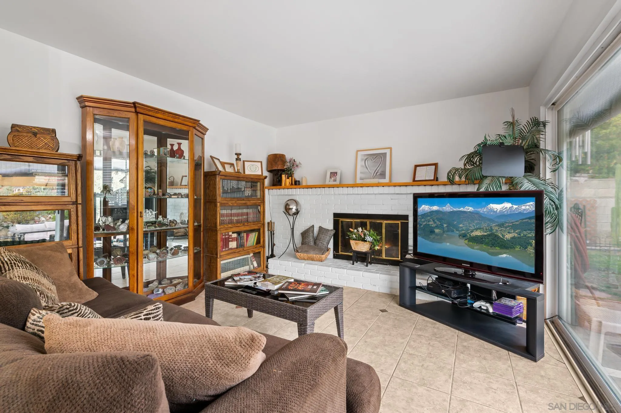 15041 Hesta Street Poway, CA 92064 - Photo 13 of 25 a living room with fireplace furniture and a flat screen tv