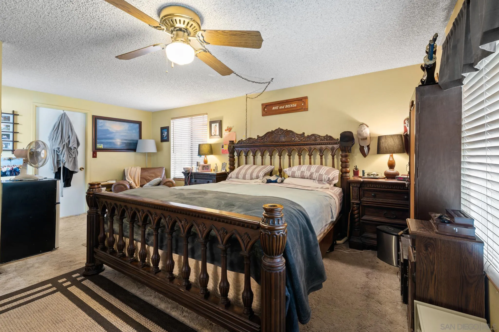 15041 Hesta Street Poway, CA 92064 - Photo 17 of 25 a bedroom with a bed and a chandelier