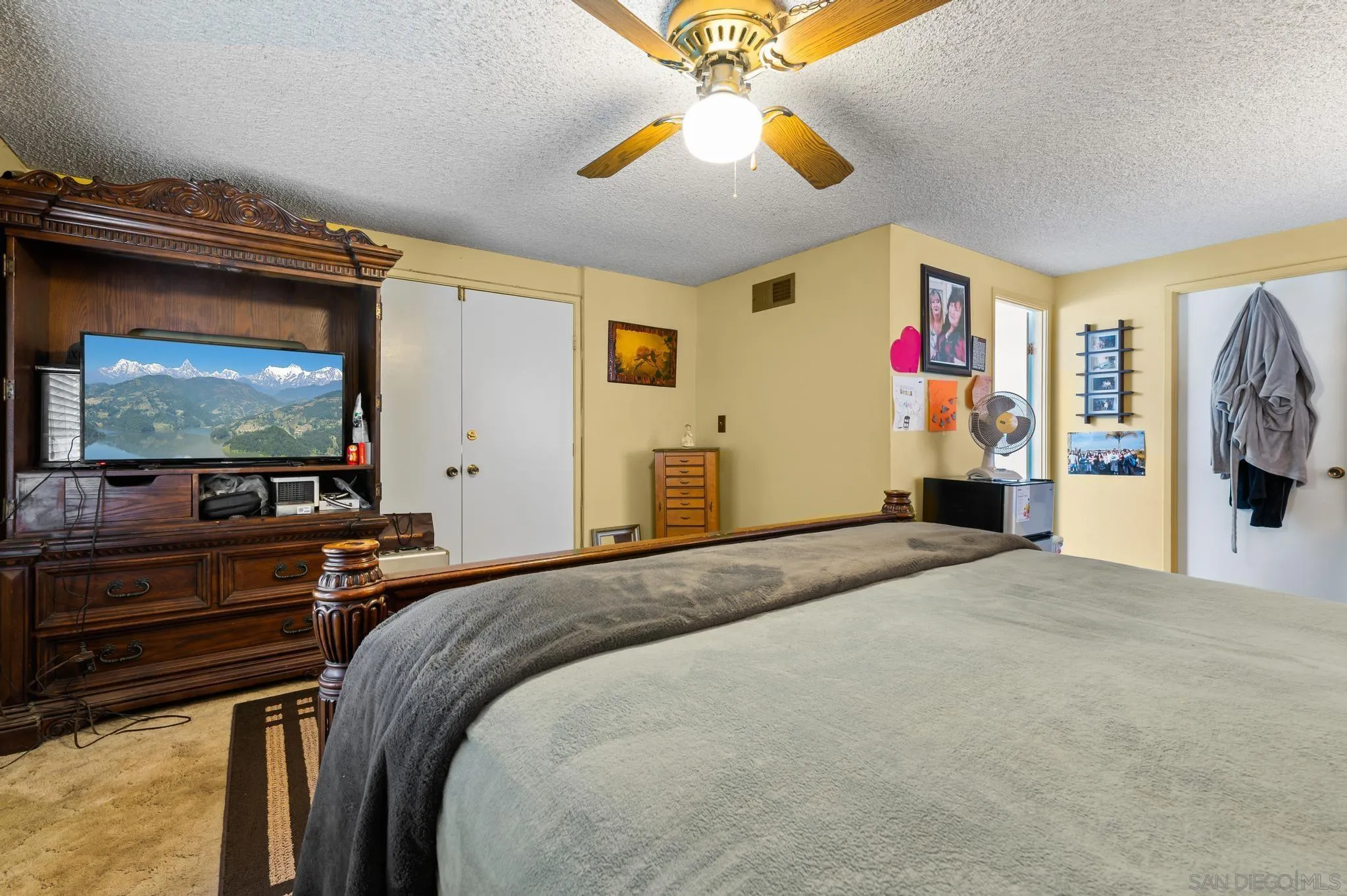 15041 Hesta Street Poway, CA 92064 - Photo 18 of 25 a bedroom with a bed and a flat screen tv