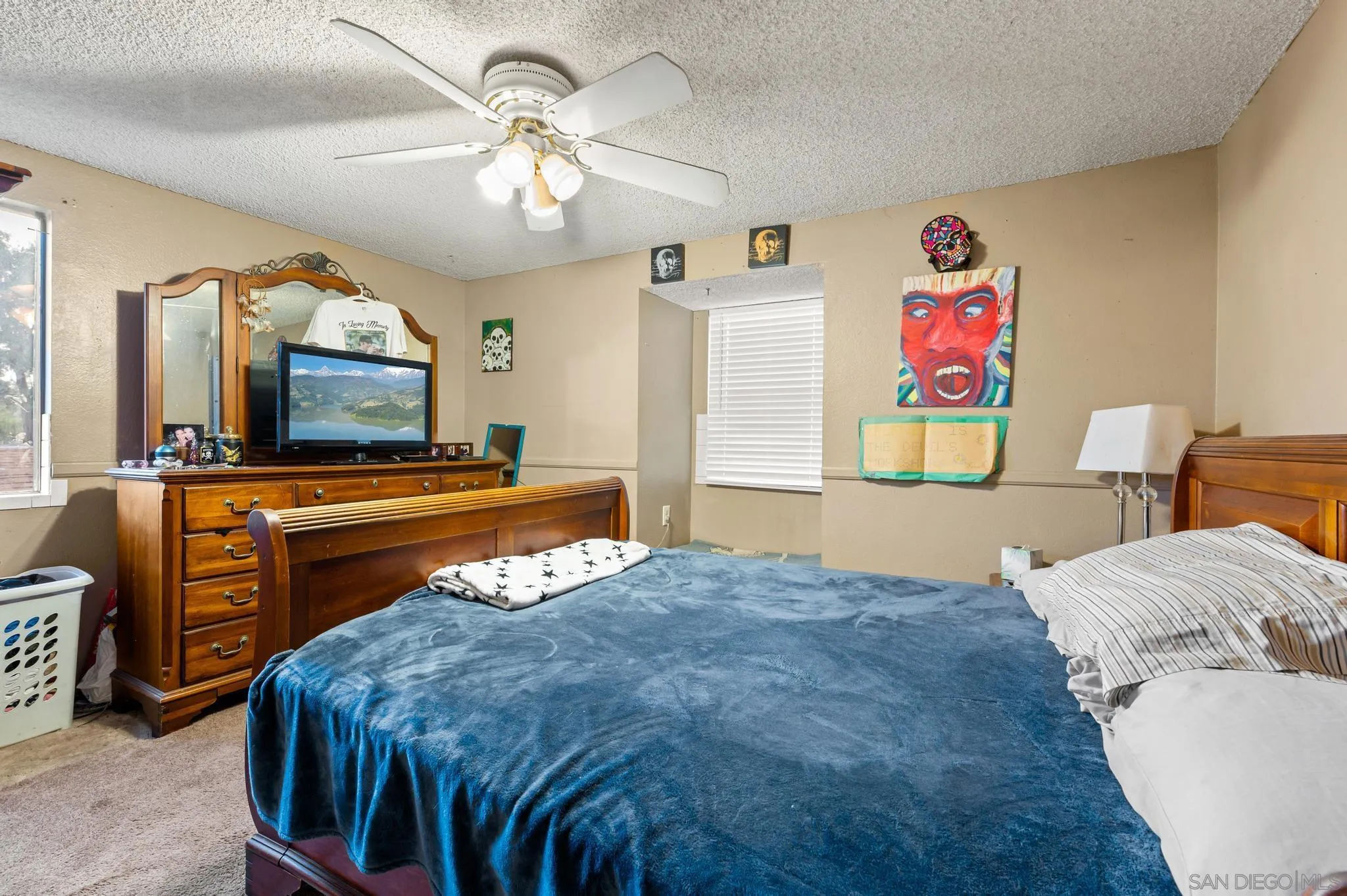 15041 Hesta Street Poway, CA 92064 - Photo 25 of 25 a bedroom with a bed and a flat screen tv