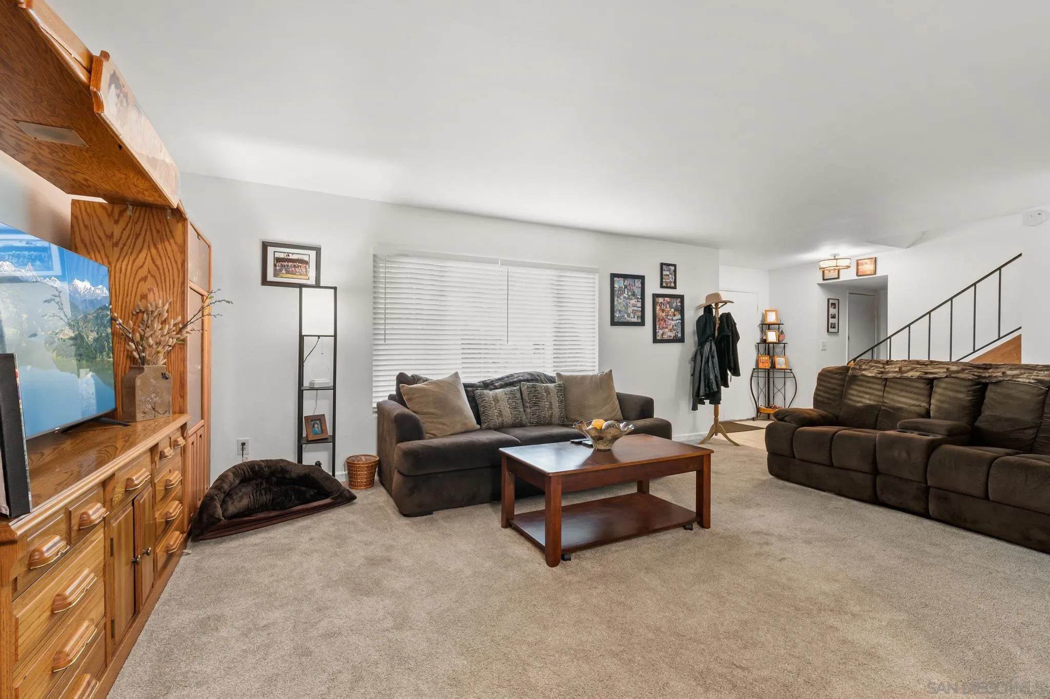 15041 Hesta Street Poway, CA 92064 - Photo 7 of 25 a living room with furniture and a flat screen tv