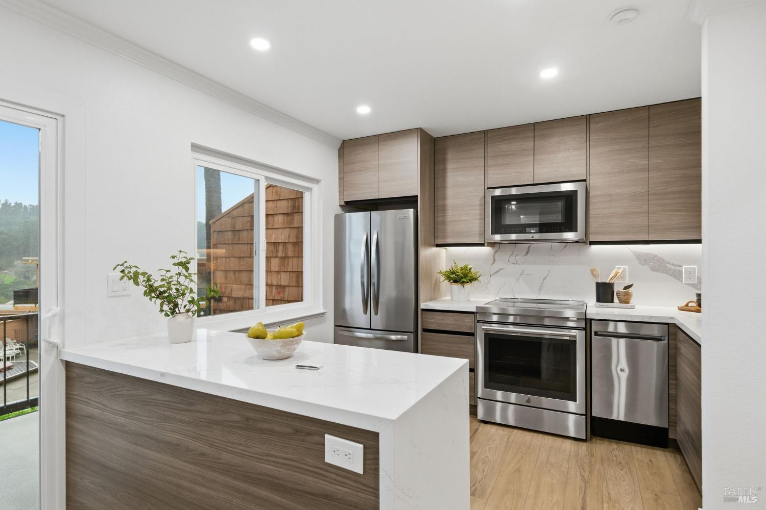 116 Stanford Way Sausalito, CA 94965 - Photo 11 of 37 a kitchen with a stove a sink and a microwave