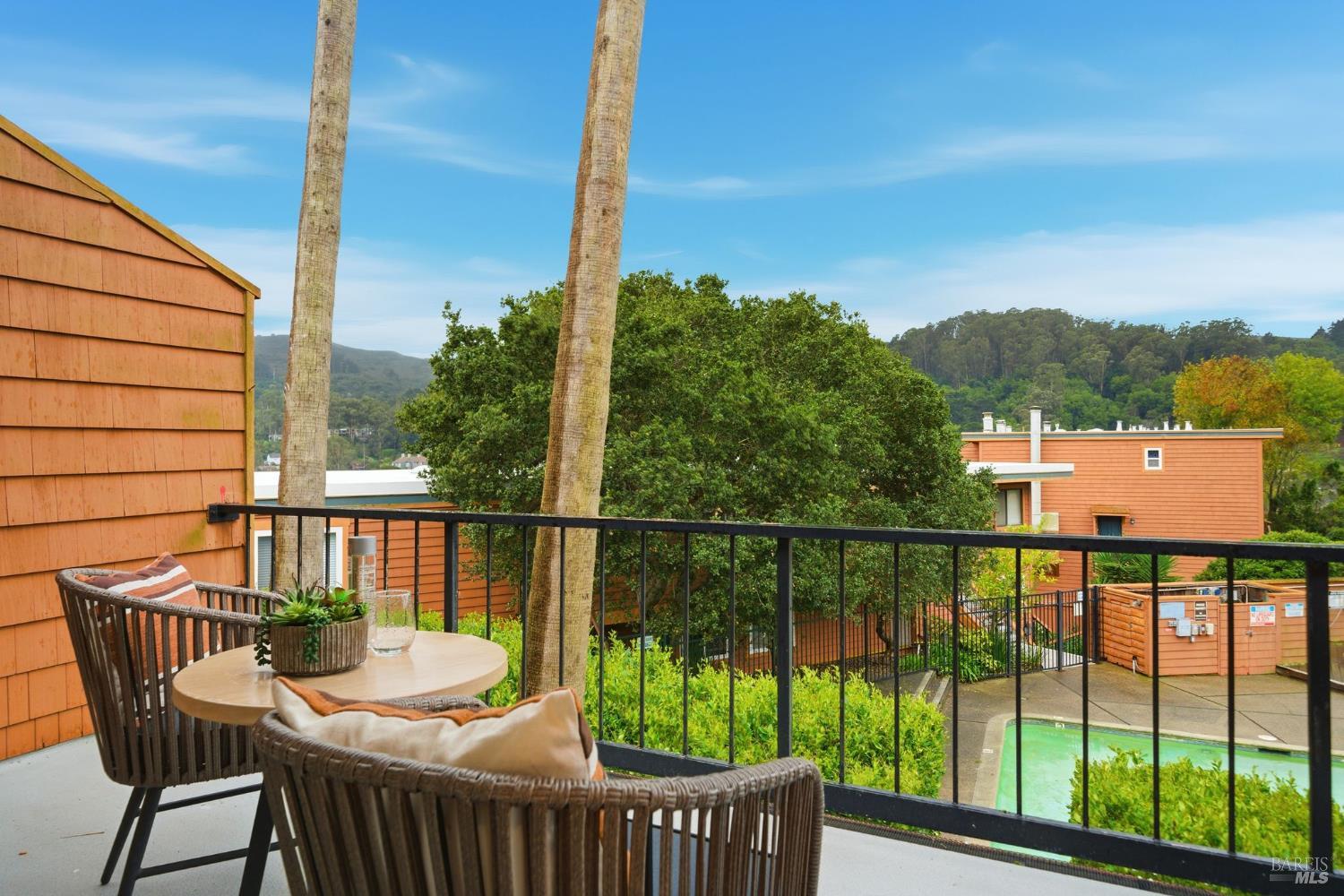 116 Stanford Way Sausalito, CA 94965 - Photo 7 of 37 a view of a balcony with chair and wooden floor