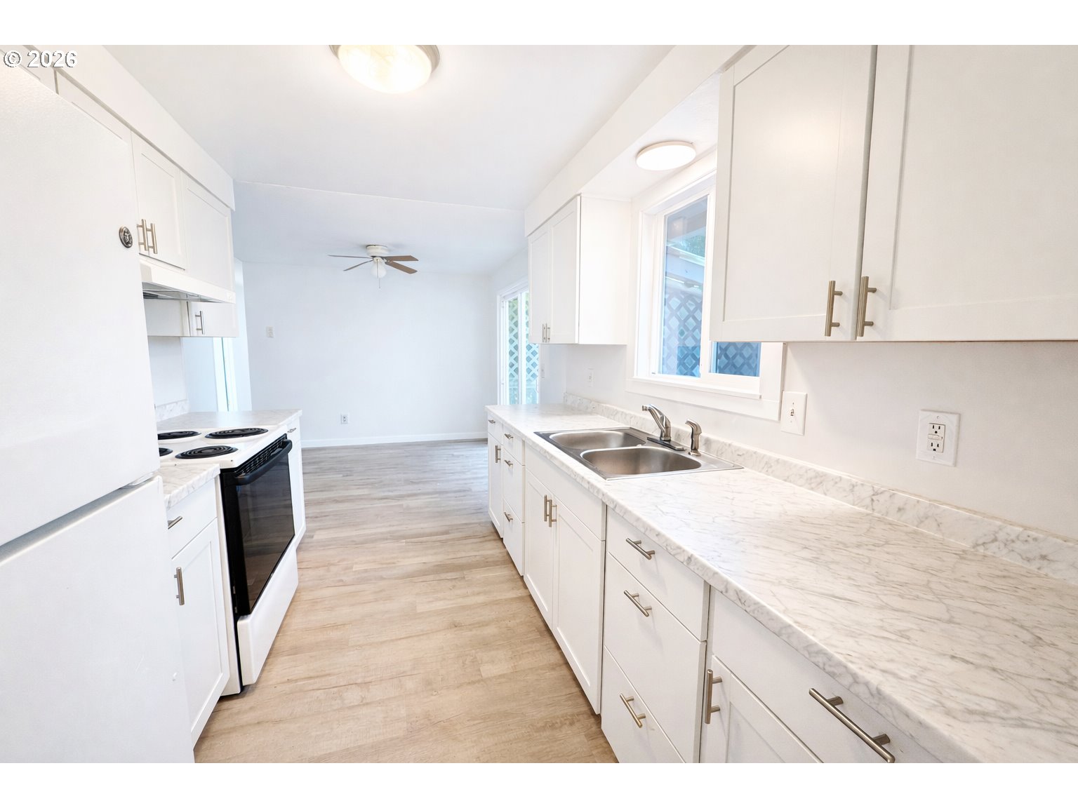 200 Roth Avenue Amity, OR 97101 - Photo 7 of 13 a large white kitchen with sink and a window