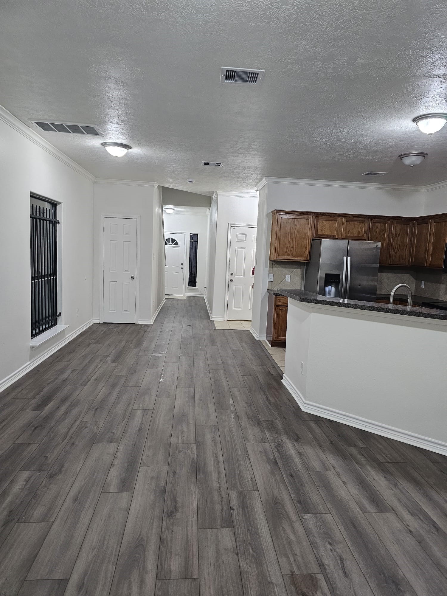 4611 B Briscoe Street Houston, TX 77051 - Photo 2 of 10 a view of a kitchen with a sink and cabinets