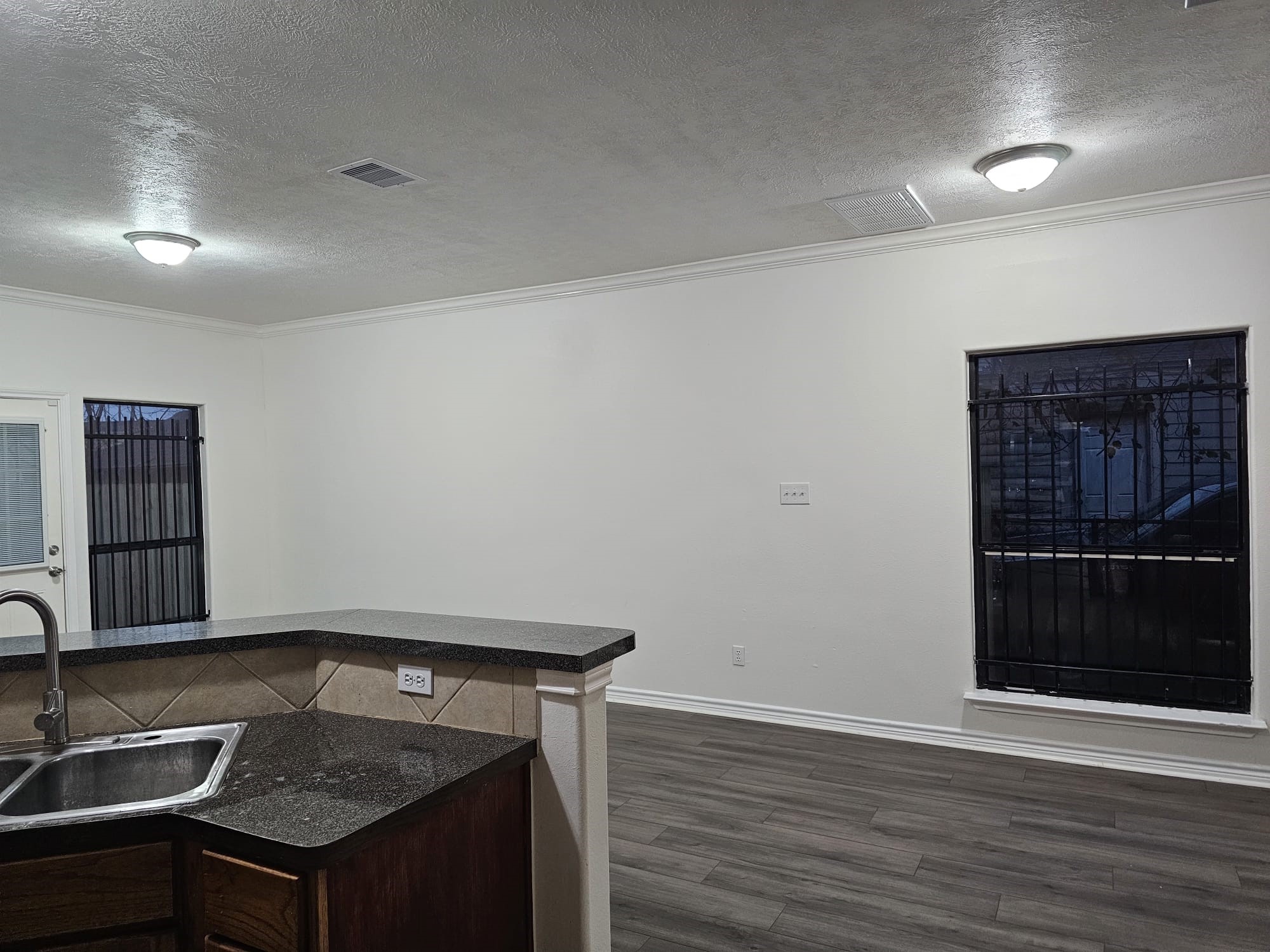 4611 B Briscoe Street Houston, TX 77051 - Photo 5 of 10 a kitchen that has a sink and a stove in it