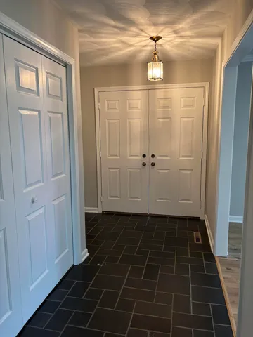 a bathroom with a glass door shower